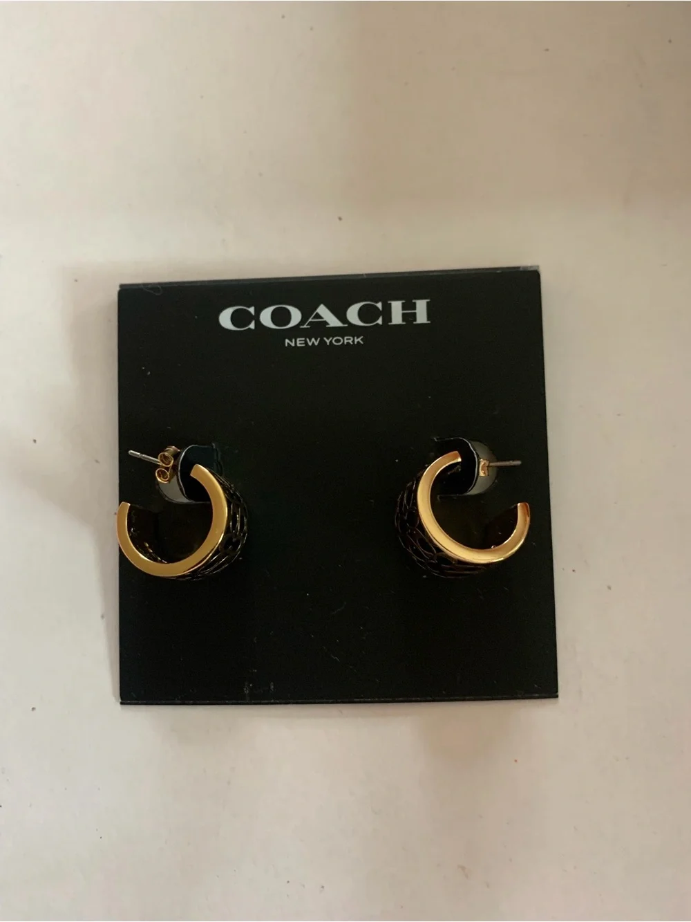 COACH Black and Gold Curved Hoop Stud Earrings - Picture 2 of 4